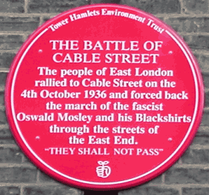 red plaque commemorating the battle of cable street
