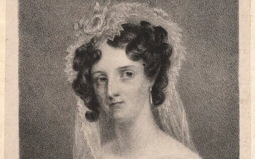 Black and white portrait of a woman with dark curly hair, a white headdress, and earrings.
