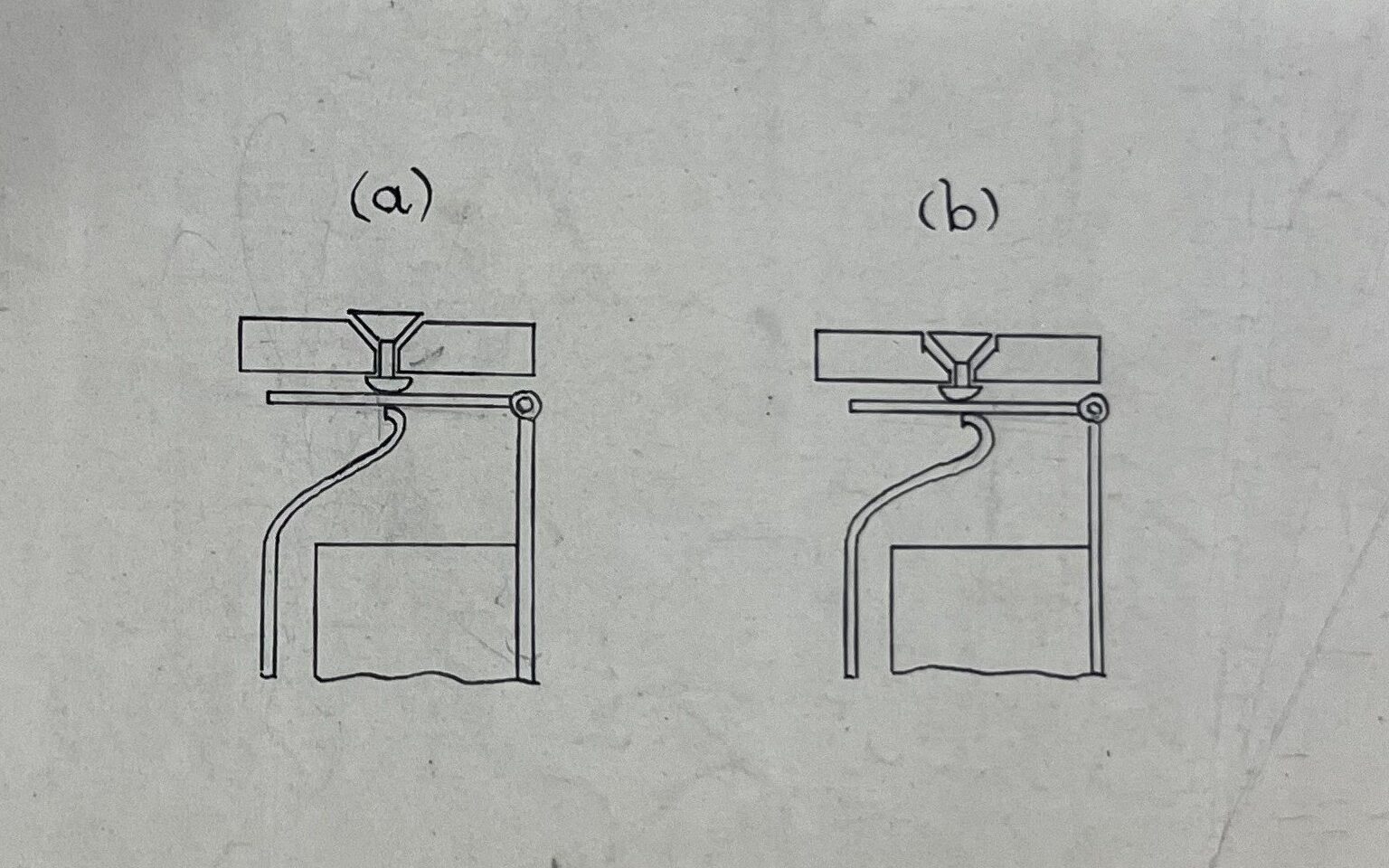 A simple black and white diagram depicting the inner workings of two switchboards in different positions.